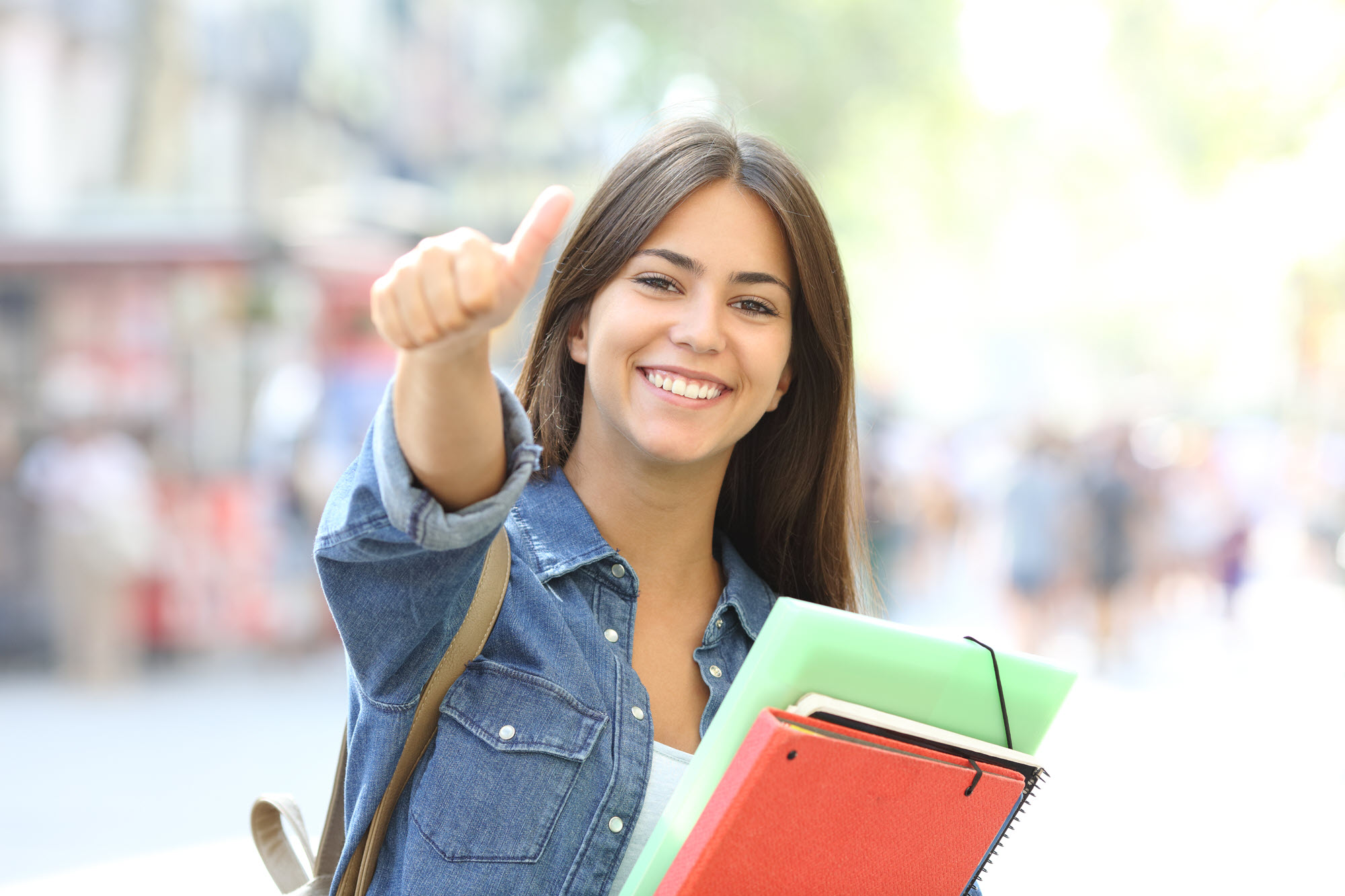 high school girl smiling with thumb up
